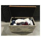 Padded bench trunk full of yarn