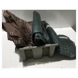 2 used tarps in a plastic bin