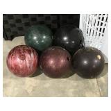 Five bowling balls