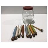 Vintage thread spools, glass jar