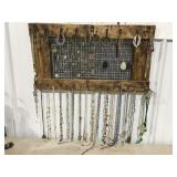 Jewelry, necklaces, earrings, bracelets on a wall