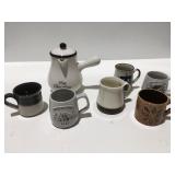 Coffee cups, hot chocolate pitcher