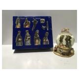 Christmas nativity scene and snow globes