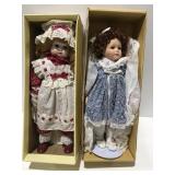 2 dolls in boxes