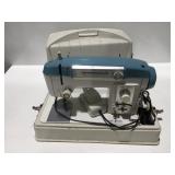 Portable, white sewing machine untested