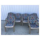 6 outdoor padded chairs & table One chair has a