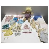 Cabbage Patch doll And doll clothes and more.