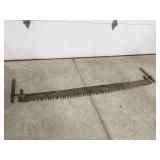 Vintage two man saw blade is 66 inches