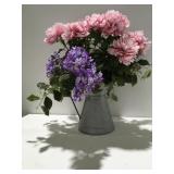 Floral arrangement in galvanized pitcher