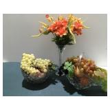 Fruit and floral arrangements in glass