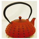 Red cast iron tea pot