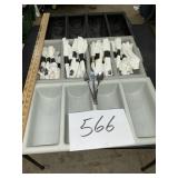 Three plastic flatware bins with approximately 50