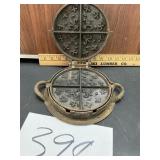 Cast-iron waffle maker  fleur-de-lis pattern