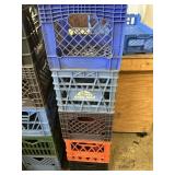 Five decommissioned milk crates