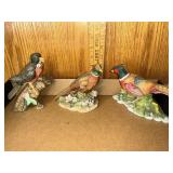 Porcelain bird figures all have subtle damage