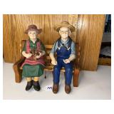 Ceramic grandparents figures on bench