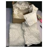 Shoebox filled with table doilies
