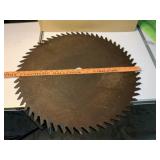 Old 24 inch sawblade appears to be 1 inch arbor