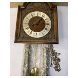 Old weighted pendulum clock