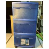 Three drawers of storage unit with wheels