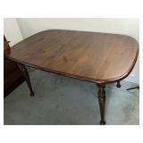 Wooden dining table with leaf