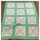 Quilt with Green and White Design
