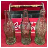 Three Early Embossed Coca-Cola Bottles with Carrie