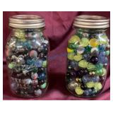 Two Ball Jars Filled With Marbles