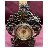 Metal Mantel Clock With Ornate Floral Design