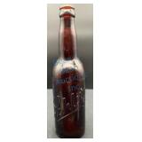 Embossed Schlitz Beer Bottle in Amber Glass