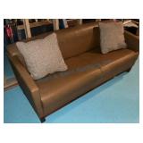 Brown Leather Two-Seat Sofa With Pillows