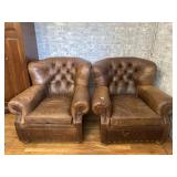 Pair of brown leather arm chairs