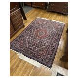 Navy, red and tan rug