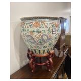 Asian fishbowl planter on wooden stand