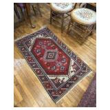 Red, green, blue and tan Rug