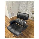 Black leather chair with footstool