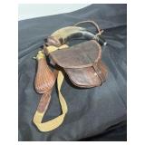 Antique leather, saddleback and powderhorn