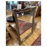 Ornate gold framed mirror