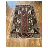 Green, red and tan Rug