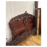 Ornate carved wood queen size bed
