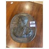 Metal oval shaped president Lincoln artwork