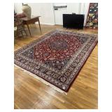 Red, burgundy and tan rug