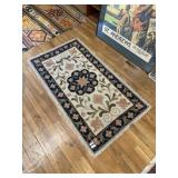 Snap blue, pink and cream colored rug
