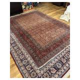 Red, tan, blue and green Rug