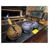 Three Cast Iron Teapots