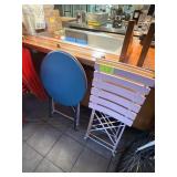 Folding blue table and folding chairs