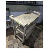 BEIGE RUBBER CART ON WHEELS