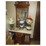 old marble top cabinet with wall hanging mirror