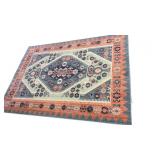 Octavia Blush Teal Area Rug