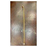 wooden walking cane made of a light-colored wood